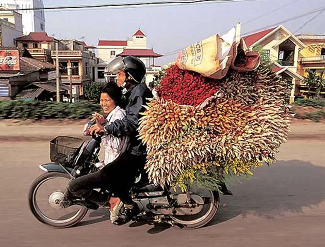 Scooter Overloaded With Flowers