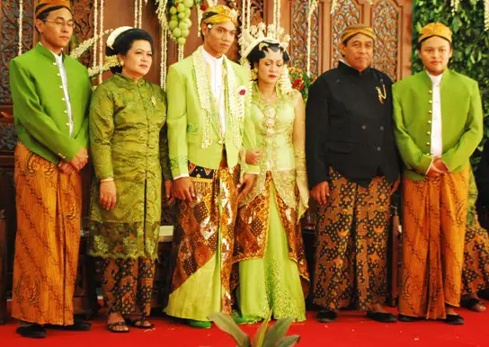 They are all dressed in traditional Javanese clothing