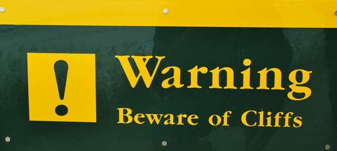 Warning Beware Of Cliffs | Oceania Travel Blog | Nugget Point, New Zealand - Strange Warning Sign Of The Week | Oceania Travel Blog | Author: Anthony Bianco - The Travel Tart Blog