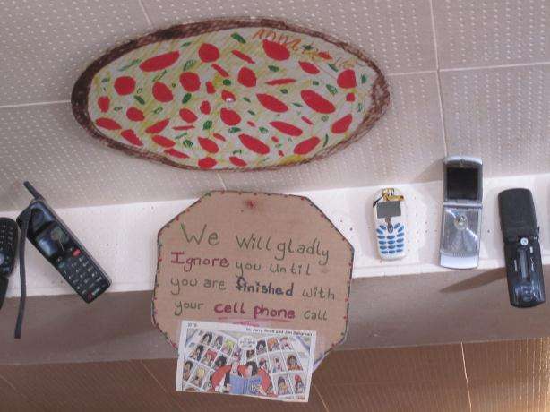 Funny Mobile Phone Sign At Pizza Parlour