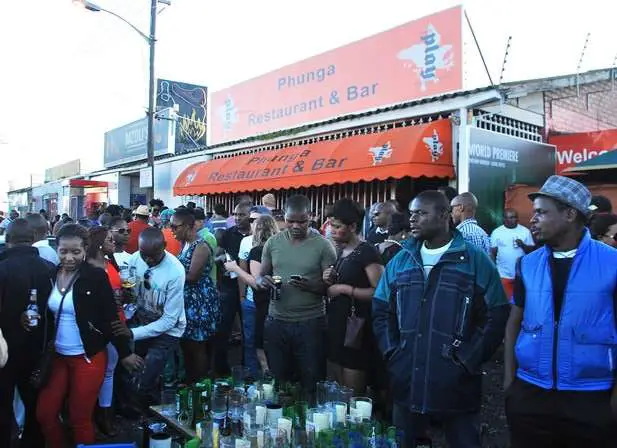 Street Party Cape Town South Africa E1548720724539 | Street Performers | Street Party At Mzoli'S, Cape Town. Buy Beer, Cook Meat, Party Away! | Street Performers | Author: Anthony Bianco - The Travel Tart Blog