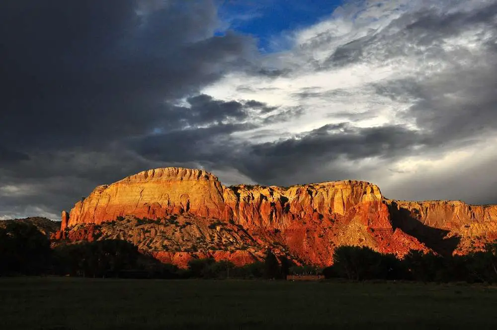 Ghost Ranch Redrock Cliffs Clouds | United States Travel Blog | Unusual Haunted Houses And Places To Visit This Halloween | United States Travel Blog | Author: Anthony Bianco - The Travel Tart Blog
